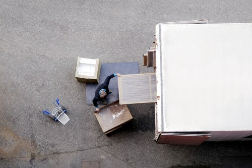 Removal team loading household items into a moving van