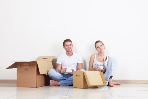 Removal van and moving boxes in Reading street setting