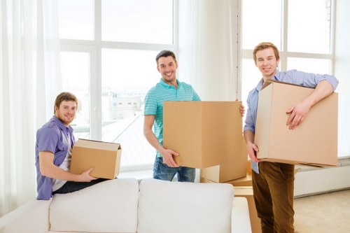 Movers carrying furniture during a home relocation in Reading