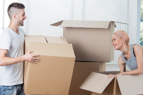 Packed moving boxes and furniture ready for loading in Reading