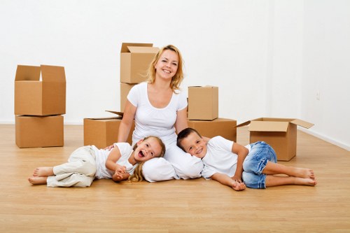 Professional moving team loading boxes and furniture