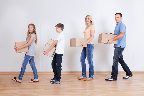 Home removals team handling furniture in Reading